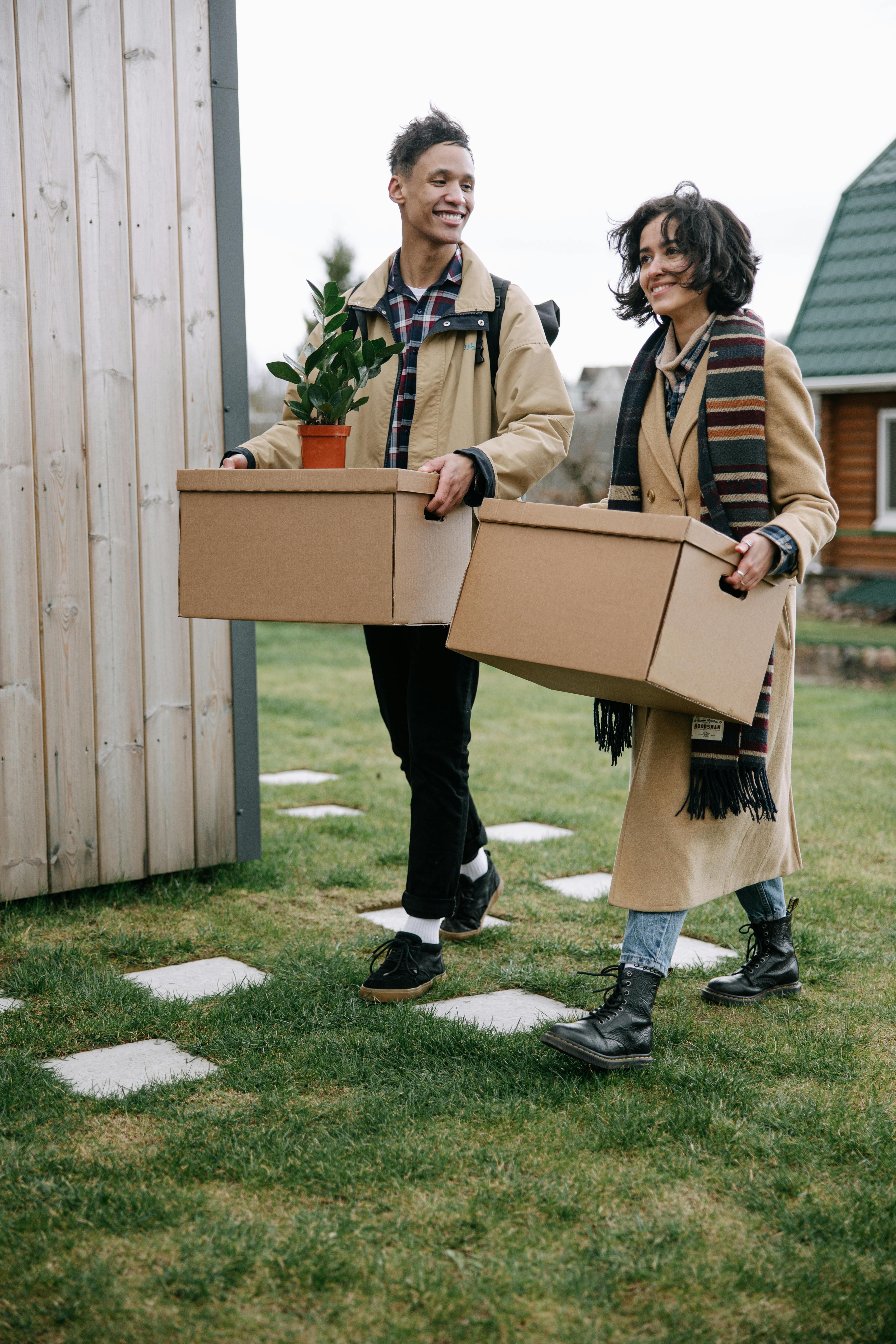 movers walking with boxes